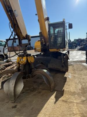 Kolové rypadlo CAT M 322 D s magnet. hlavou
